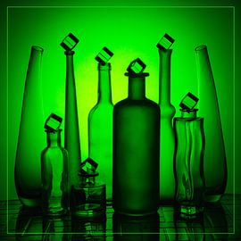 Green bottles against a green background and surface. by Gerhard de Wit