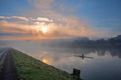 Water sports course with emerging fog banks over the water