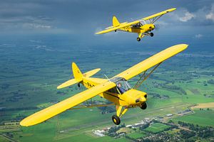 Two Piper Super Cub Aircraft in formation by Planeblogger