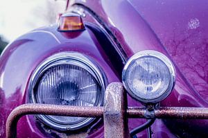 Volkswagen Beetle. Close up of the lamps and rusty bumper. by Birgitte Bergman