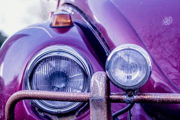Volkswagen Beetle. Close up of the lamps and rusty bumper. by Birgitte Bergman