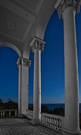 The ruins of an abandoned hotel are decay and destruction. symbol of decline.Beautiful white columns by Michael Semenov