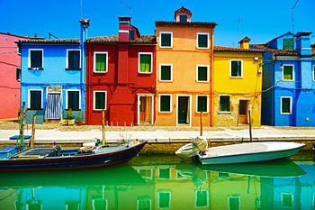 Colourful houses and boats in Burano island, Italy