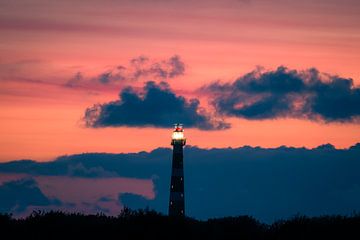 The ameland lighthouse in evening red