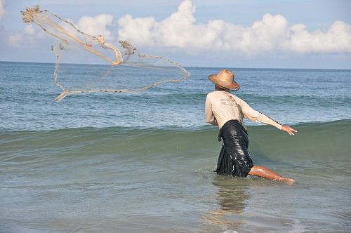 A Burmese fisherman in action