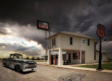 Petrol pump on Route 66 just before an upcoming storm surge. by Humphry Jacobs