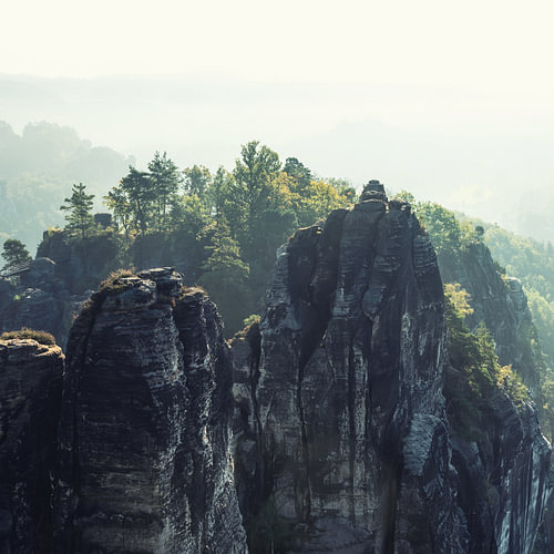A rock face in the mist