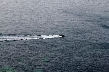 Speedboat at sea by Russell