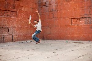 Boy playing cricket in Varanasi India. Wout Kok One2expose by Wout Kok