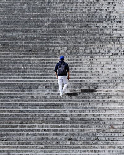 Abstract photo of a man walking up the stairs in paris