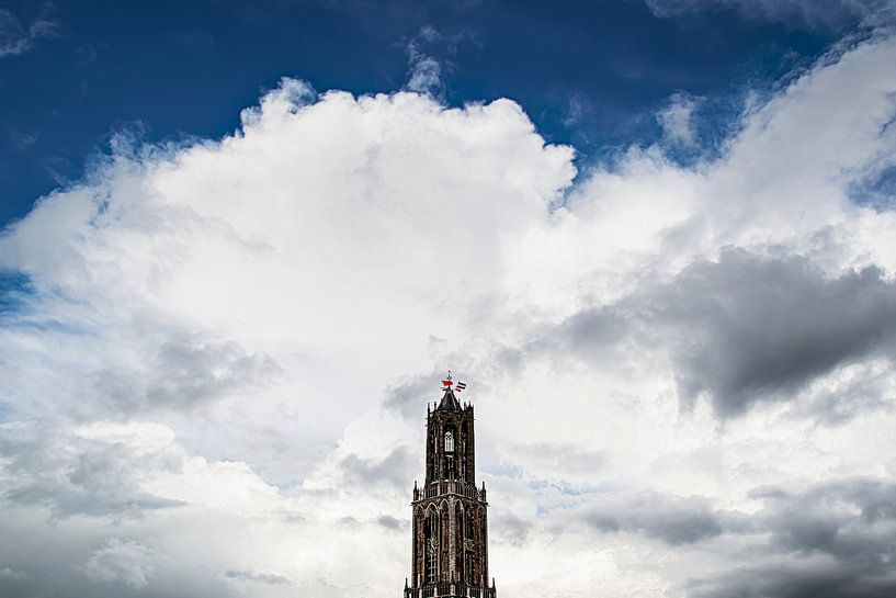 The Dom tower in Utrecht during King's Day 2016. by Margreet van Beusichem