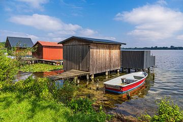 View of boathouses and boat in the town of Zarrentin am Schaal by Rico Ködder