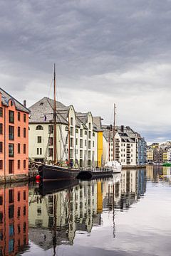 Sailing ships and art nouveau houses in the town of Ålesund in Norw by Rico Ködder