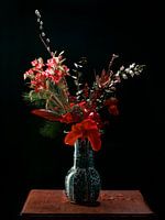 Delft blue vase with red flowers