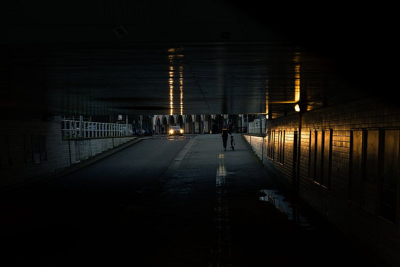 Viaduct illuminated by the oncoming car by Koen Verburg