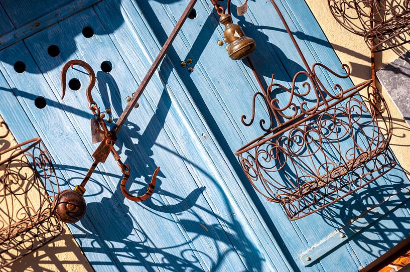 Old blue door with rusty ornaments by Wil Wijnen