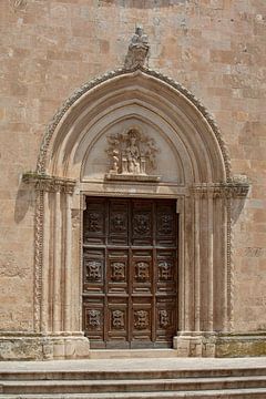 Door of cathedral Santa Maria Assunta in Ostuni, Italy by Joost Adriaanse