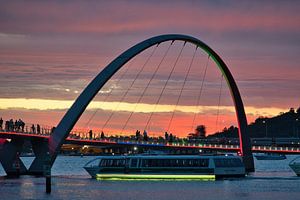 A Transperth ferry passing the bridge