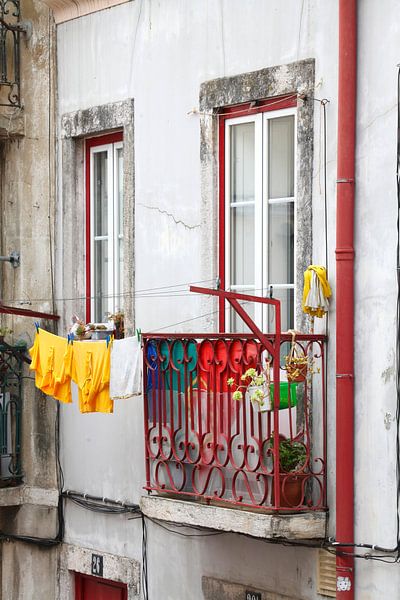 Old balcony with clothesline at Bairro Mouraria, Lisbon, Portugal by Torsten Krüger