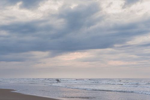 Lonely surfer at Terschelling sunset