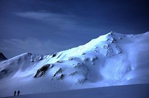 Skiers in front of the immensity of the landscape, French Alps