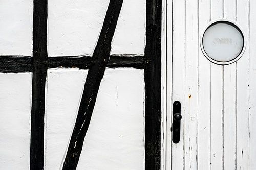 Half-timbered façade with wooden door