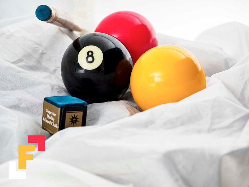 billiard balls with cue by Delphine Kesteloot