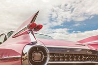 The pink classic Cadillac car