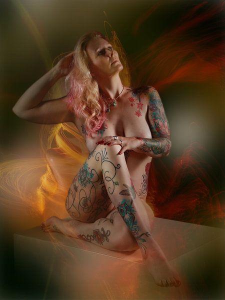 Naked beauty on cube in flares of light by Henk Bouckaert