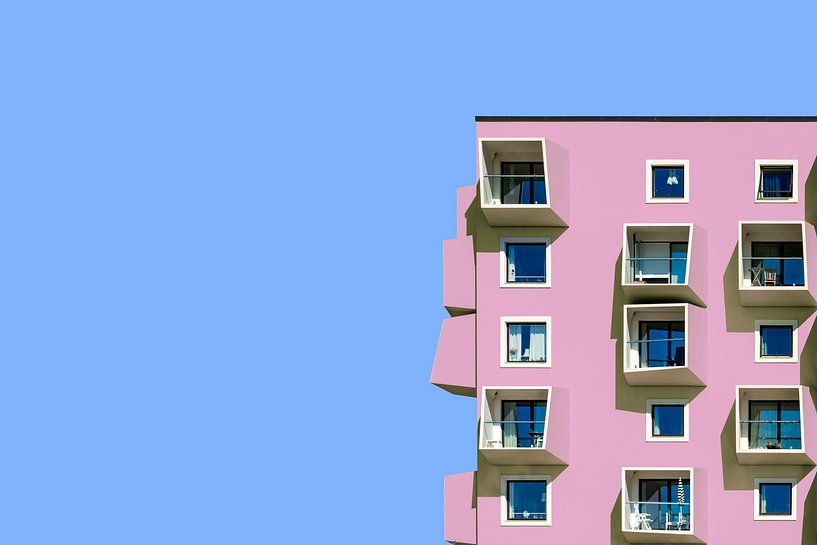 Pink building against blue sky by Maerten Prins
