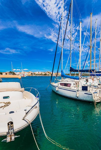 Marina harbor with moored sailing yachts in Porto Colom by Alex Winter