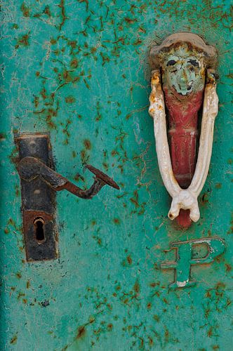 Detail of an old door with door knocker by Thea Oranje