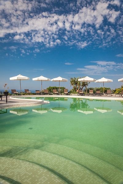 Pool with umbrellas in Forio, Ischia Island, Italy by Christian Müringer