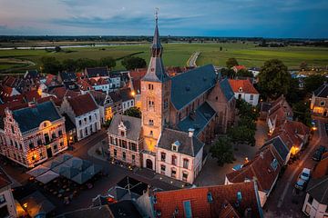 Hattem church tower from above with the Ijssel river and Zwolle