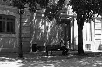 An elderly man taking a break in the streets of Nîmes