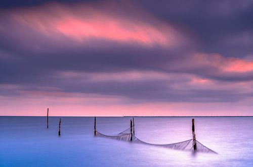 Fishing nets along the lake in the evening sun