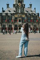 Woman in front of the town hall in Delft - Netherlands