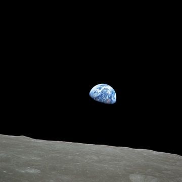 Earth rising over the lunar horizon by NASA and Space