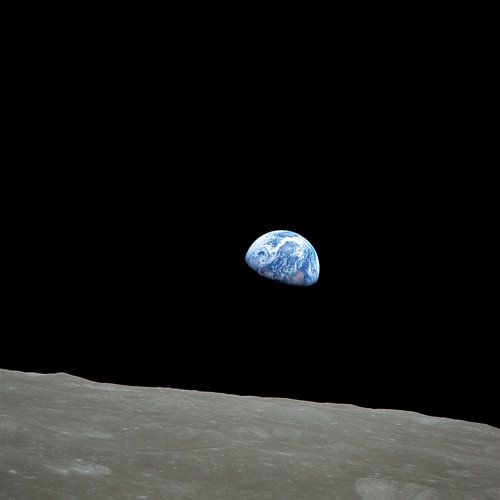 Earth rising over the lunar horizon by NASA and Space