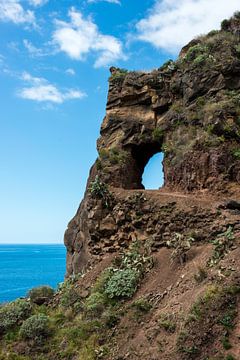 rocks with hole with blue sky view