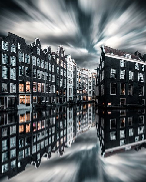 Amsterdam canal houses reflection dramatic sky by vedar cvetanovic