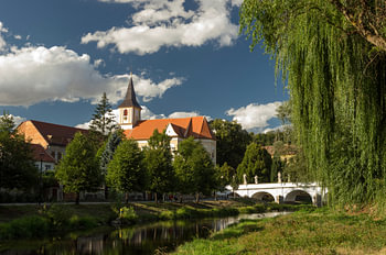 Tranquil Summer Riverside with Historic Baroque Bridge and Church for Classic Living Room Decor