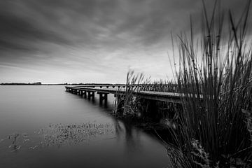 Windy sunset with jetty by Dethmer Kupers