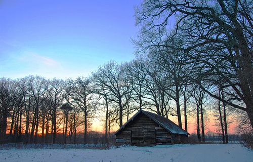 Old barn on a winter evening