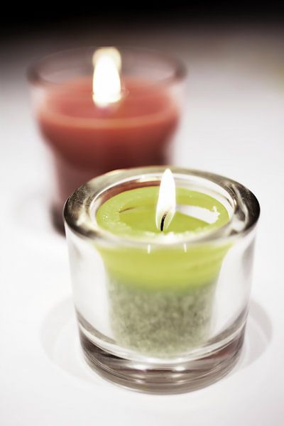 Tea lights on a table by Heiko Kueverling