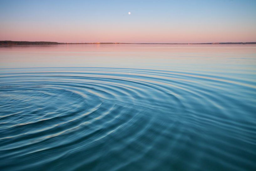 The turquoise lake at dawn.small symmetrical waves of blue and turquoise lake surface at dawn, red a by Michael Semenov