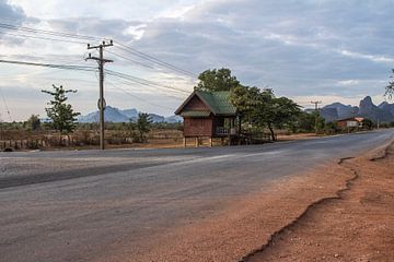 Cabin on the road in Laos by Anne Zwagers