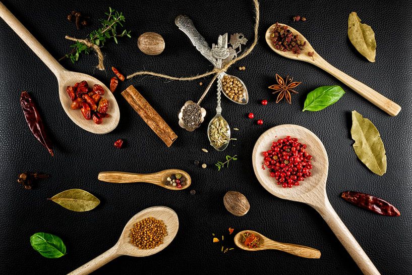 Herbs and spices with wooden ladles by Carola Schellekens