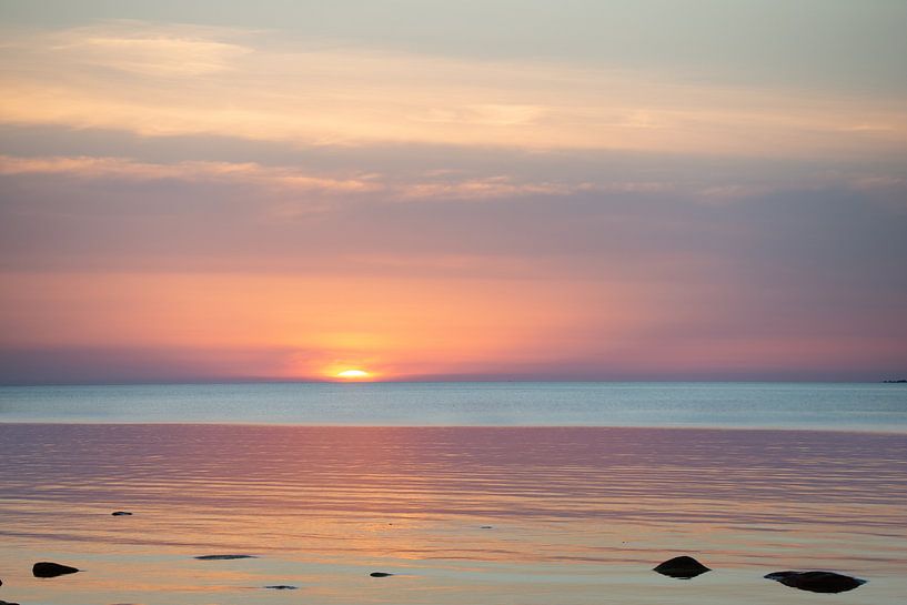 Sunset with a calm sea by Ellis Peeters