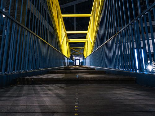 Night shot with a road and railing